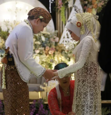 Couple talking about intimacy and cultural expectations in bedroom